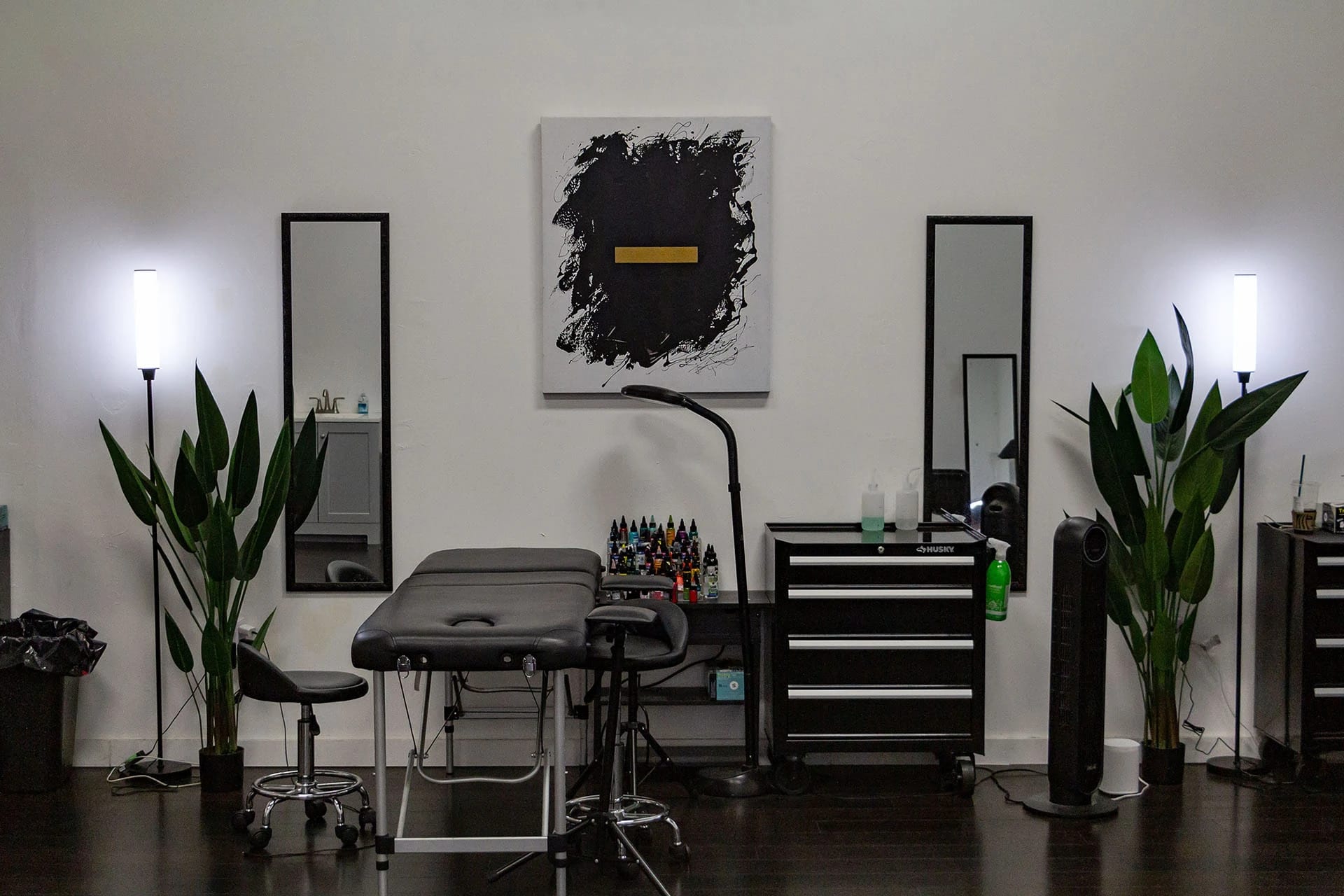 Tattoo studio interior with plants and artwork